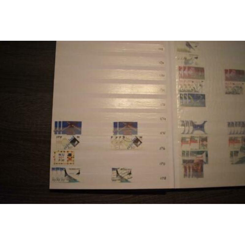 2) stockboek postzegels nederland postfris en gestempeld