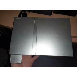 Playstation 2 + 2 controllers + memorycard + 4 games