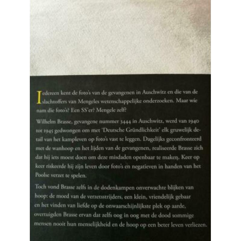 Oorlogsroman "De fotograaf van Auschwitz". In prima staat.