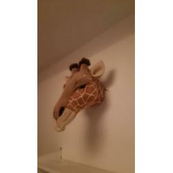 Giraffe dierenkop voor aan de muur