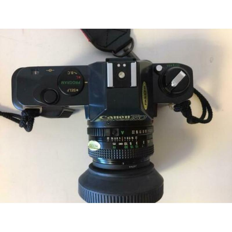 Nieuwstaat Canon T50 met Tokina 70-210 mm lens, flitser, tas