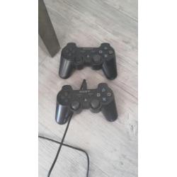 Playstation 3 incl 2 controllers en 12 spellen.